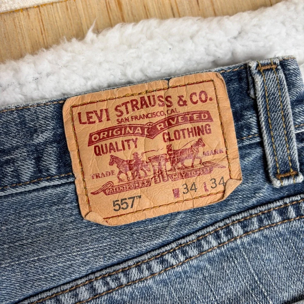 Y2K Levis 557 Relaxed Bootcut Jeans Mens 34x34 Light Wash Distress Denim FADE